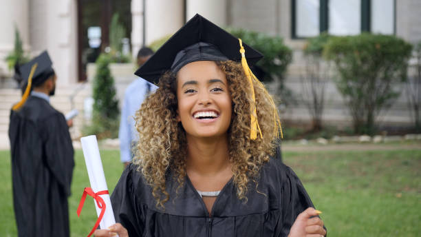 istock Excited female college graduate with diploma 1032209572
