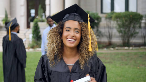istock Beautiful female college graduate 1032209588