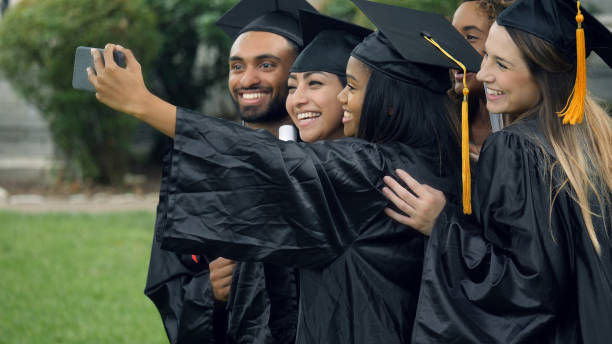 istock College graduates capture memories 1032209630