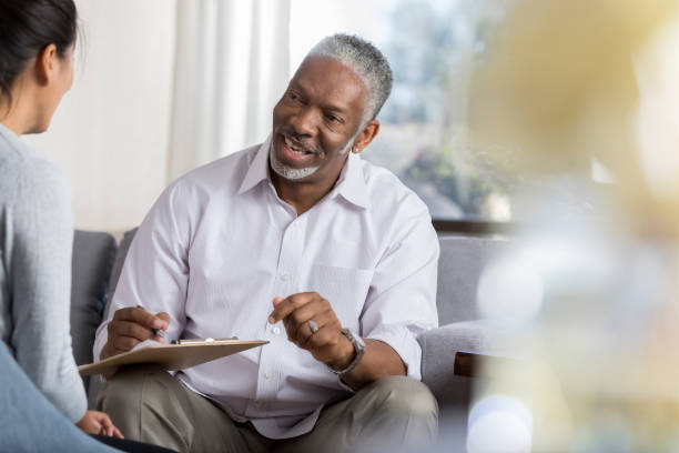 istock Senior male therapist shares positive thoughts with client 1032209884