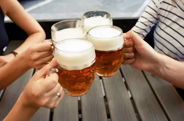 Photo of Friends having beers in beer garden