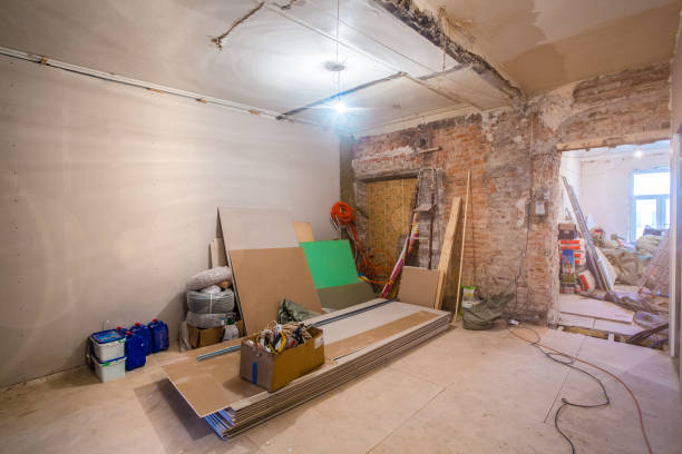 istock Working process of installing metal frames for plasterboard -drywall - for making gypsum walls  in apartment is under construction, remodeling, renovation, extension, restoration and reconstruction. 1032231372
