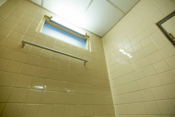 istock aluminium towel hanger on square wall tile in bathroom 1032235478