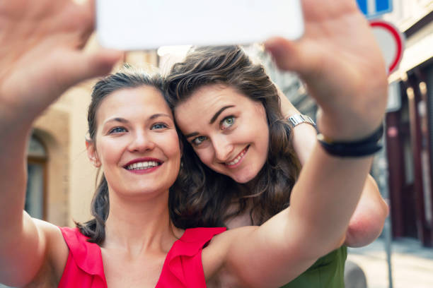 istock Girlfriends taking selfies in the city streets 1032254520