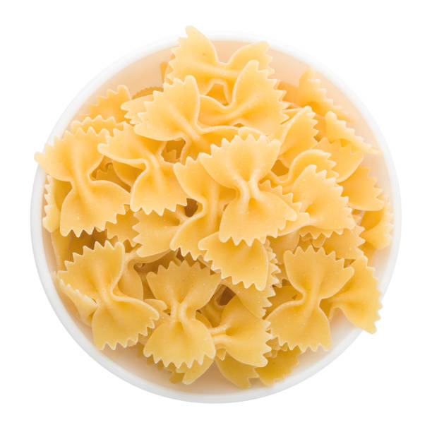 istock pasta in plate, isolated on white background, clipping path 1032256400