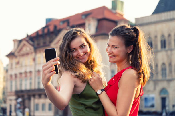 istock Girlfriends taking selfies in the city streets 1032260684