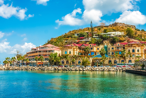 A modern stucco shopping center on the coast of a tropical island