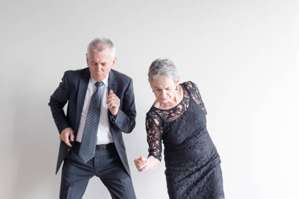 istock Senior Couple Dancing Against White Background 1032283020