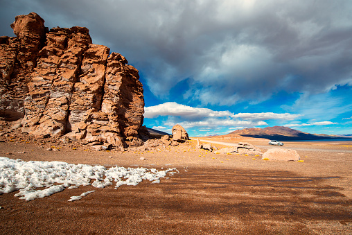 Landscape of Tara salar in Atacama region with a car um background