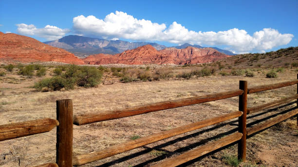 istock Cloud cap over Pine Valley Mountains and view of Red Cliffs National Conservation Area with its red rocks and desert landscape 1032290720