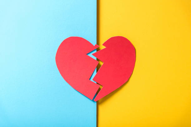 istock High Angle View Of Broken Heart Shape On Papers 1032295944