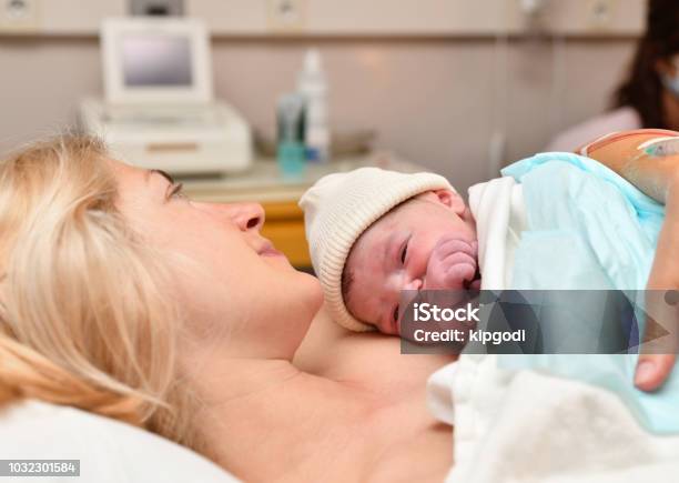 Mom And Newborn Baby Skin To The Skin After Birth In The Hospital Stock Photo - Download Image Now