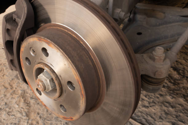 Brake disc, caliper and ball joint of a car.