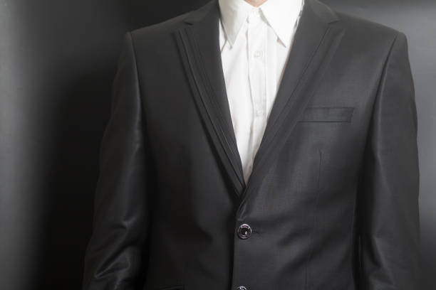 istock Man in black suit and white shirt 1032306304