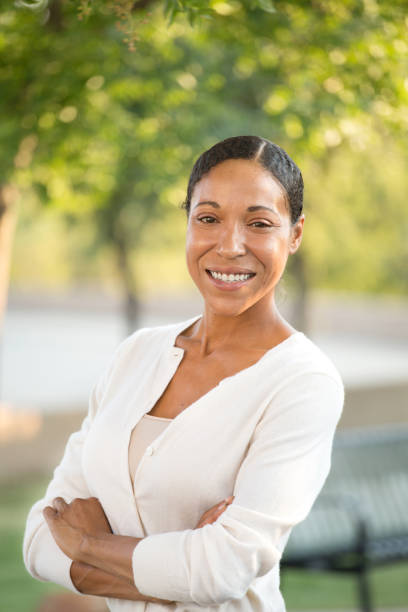 istock Confident diverse woman smiling with her arms crossed. 1032334886