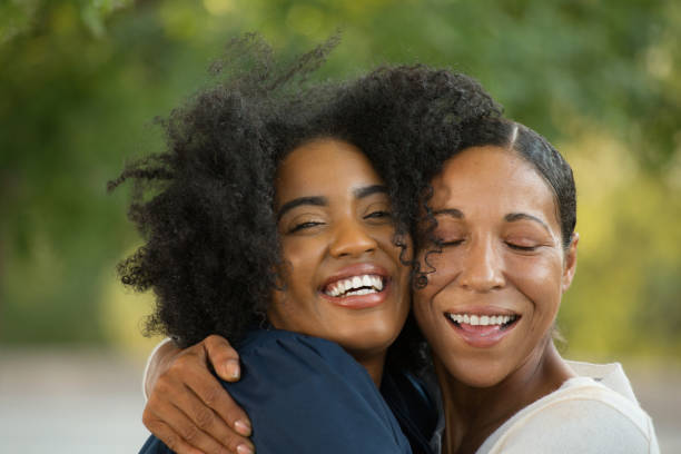 istock Mother hugging her daughter at her graduation. 1032335398