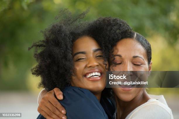 Mother Hugging Her Daughter At Her Graduation Stock Photo - Download Image Now - Mother, African-American Ethnicity, Daughter