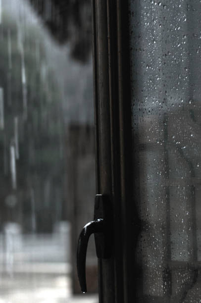 istock Traditional Chinese bronze window in rain 1032335722