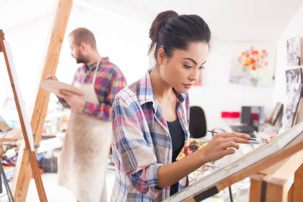 istock Female artists drawing in studio 1032338590