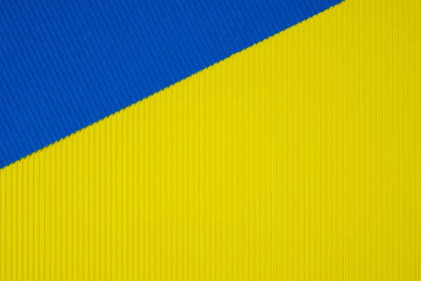 istock Blue and yellow corrugated paper texture, use for background. vivid colour with empty space for add text or object. 1032339020