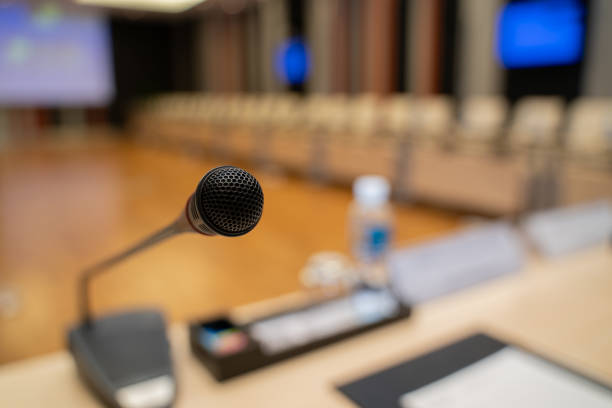 istock Microphone over the blurred business forum Meeting or Conference Training Learning Coaching Room Concept, Blurred background. 1032344152