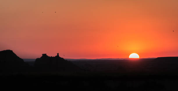 istock Badlands Sunset with birds in distance 1032348526