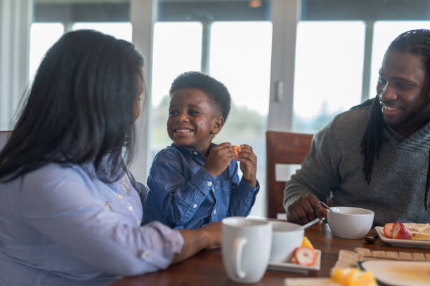 istock African American family eating breakfast together 1032353802