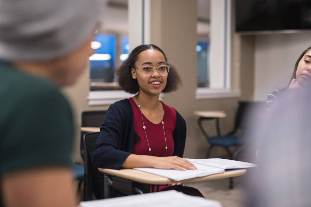 istock Students at their desks in a university classroom 1032359064