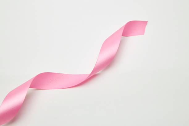 istock Pink curly ribbon isolated on white 1032371916