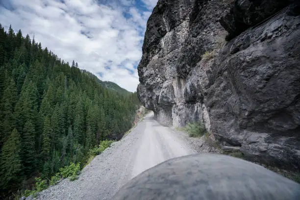 Photo of Narrow ATV road with low overhanging rock