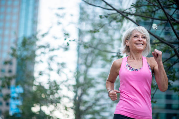 istock Smiling Woman Jogging 1032420524