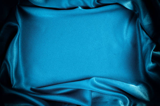 istock Texture, background. template. Silk fabric blue, Blue silk drapery and upholstery fabric from the courtyard - Dark curtains - Solid fabrics for backs and pillows 1032422926