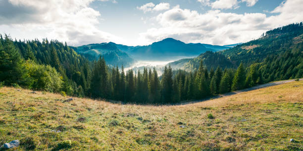 panorama of mountain and foggy valley stock photo