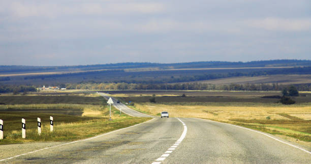 istock Highway landscape with moving cars at daytime 1032436726