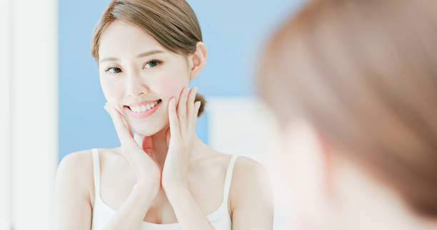 istock beauty woman touch her face 1032439506