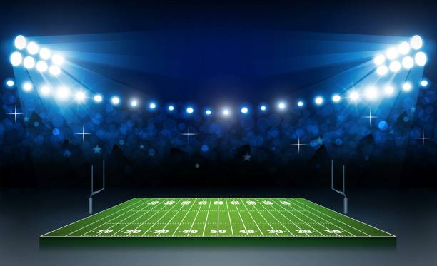 istock American football arena field with bright stadium lights design. Vector illumination 1032442516