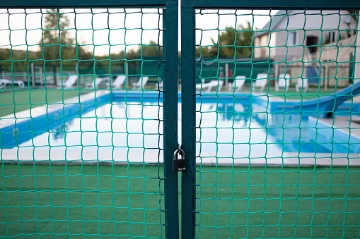 A closed gate at the entrance to the pool