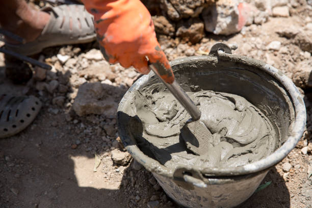 istock bucket of mixed cement mortar for plaster wall or welding brick. image for building construction concept. 1032460266