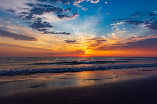 istock Amazing colorful sunrise at sea 1032460296