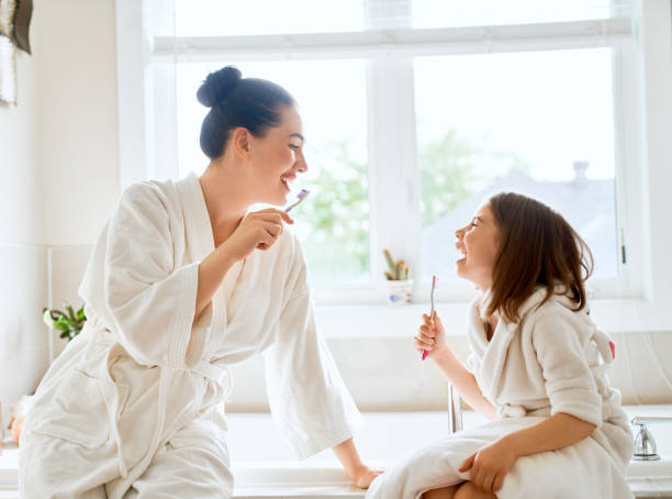 istock family are brushing teeth 1032460496