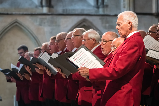 Rochester, England -  July 2018 : Mens choir performing in a cathedral, Kent, UK