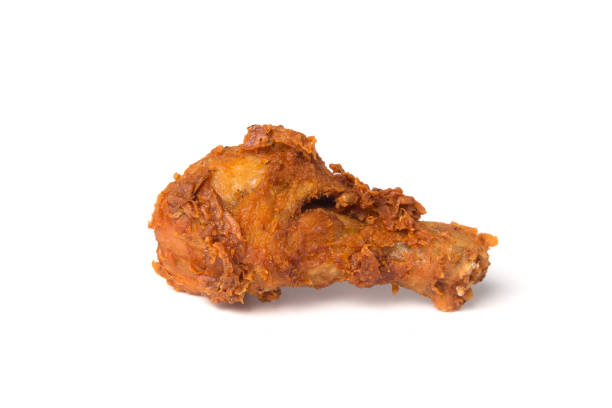 istock Crispy fried chicken leg isolated on a white background 1032463508