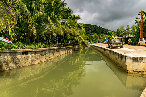 Old Town, Koh Lanta, Thailand - August 25, 2018:  Old Town, Ko Lanta, Krabi, Thailand is a fishing village and port.  Established hundreds of years ago by Chinese/Malay/Thai traders, it is steeped in tradition.  Here we see the main canal running through the village.