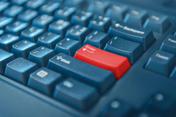 istock Close-up of computer keyboard with red button. selected focus on enter button. 1032464436