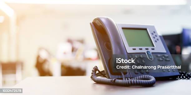 Close Up Soft Focus On Telephone Devices At Office Desk For Customer Service Support Concept Stock Photo - Download Image Now