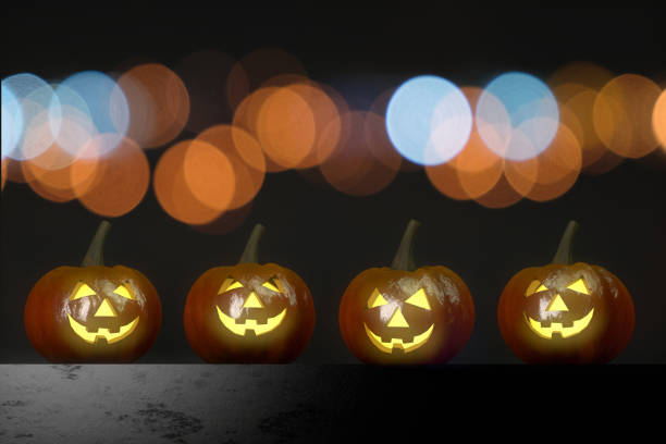 istock Pumpkins for halloween with spooky face, Jack O' Lantern with Bokeh 1032476556