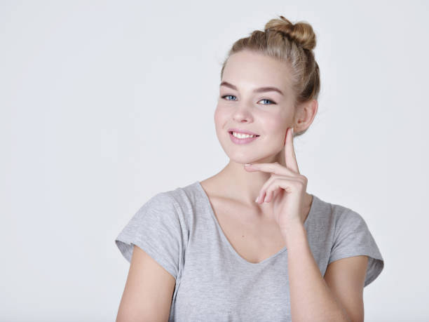 istock young thinking caucasian woman with finger near face 1032476668