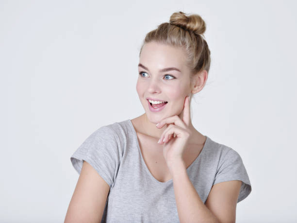 istock young thinking caucasian woman with finger near face 1032476680