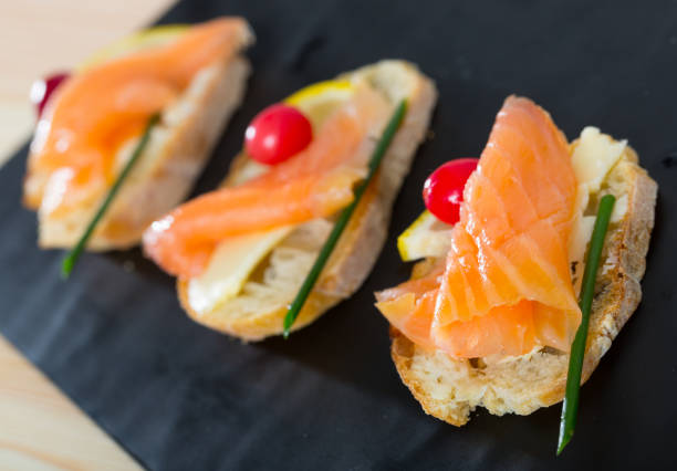 istock Canapes with salmon, butter and cranberries 1032480110