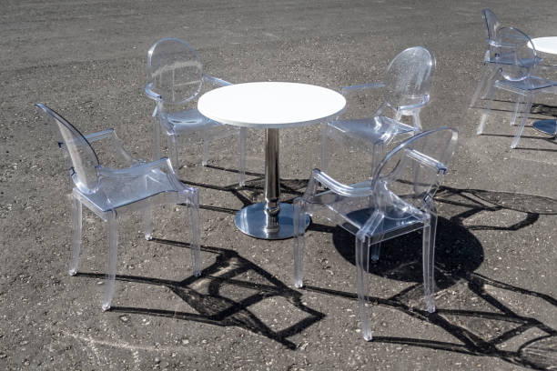 istock Coffee table with transparent chairs on the street 1032480302
